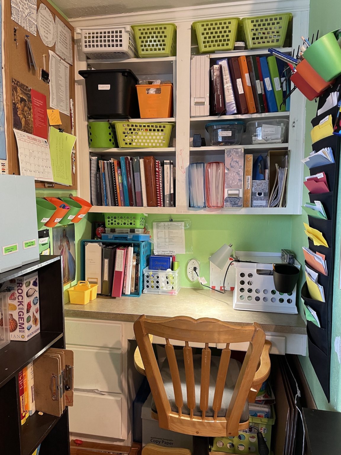 My teachers desk, close to the toddlers bench area. The wall organiser on the right side is where I keep printouts of upcoming weeks, and other activities that I print out. I also keep any corrected work I need to go over with anyone, there. 
